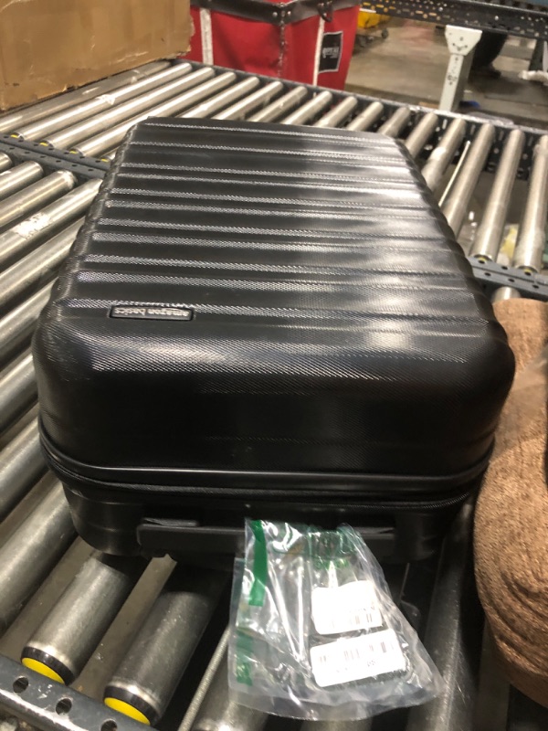 Photo 1 of AmazonBasics Hardside Carry On Spinner Travel Luggage Suitcase - 20 Inch, Black