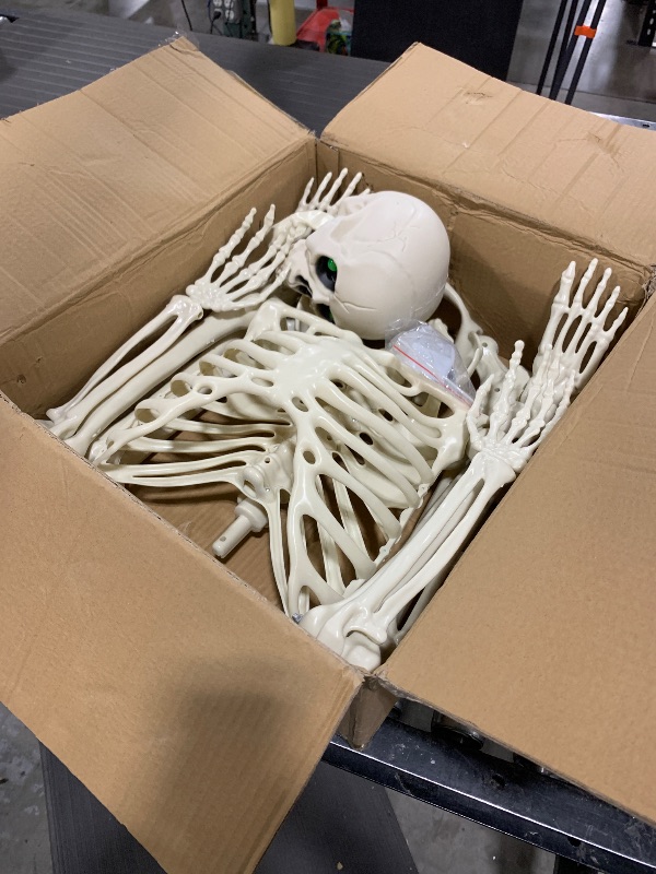 Photo 1 of 5.4FT Full Size Halloween Skeleton, Life Size Posable Skeleton with Glowing Eyes Scary Sound, Plastic Skeleton with Movable Joints for Halloween Decoration