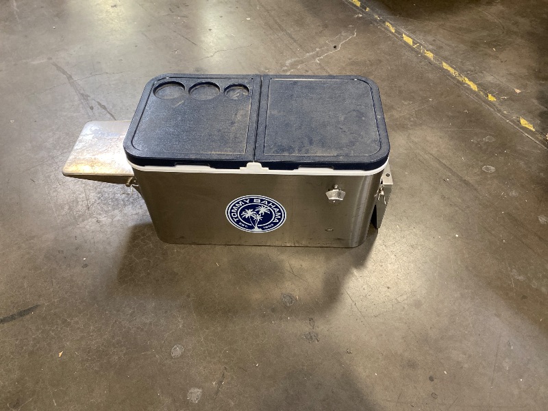 Photo 1 of Tommy Bahama 100 Quart Rolling Stainless Steel Cooler with Wheels, Attached Bottle Opener and Cap Catcher