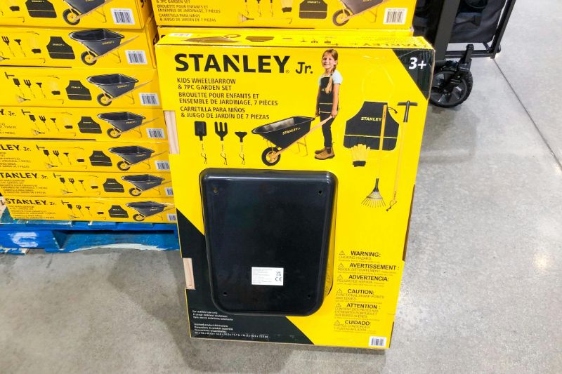 Photo 1 of Stanley jr wheelbarrow and 7-piece garden set