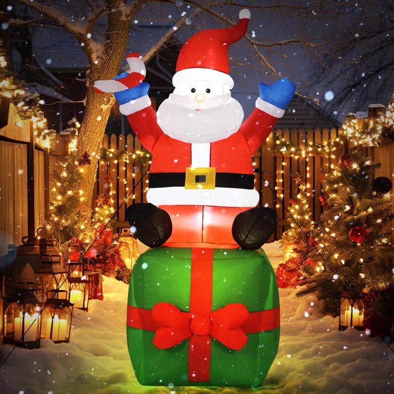 Photo 1 of 6 FT Christmas Inflatable Decorations, Santa Claus Sitting on Gift Box, with Build-in LEDs for Yard Indoor Outdoor Garden Party