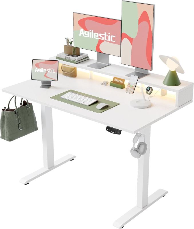 Photo 1 of Electric Height Adjustable Standing Desk with Power Outlet and LED Light Strip, Sit to Stand, Ergonomic 48x24" Rising Desk with Memory Presets, Home Office Workstation, Computer Gaming Table, White