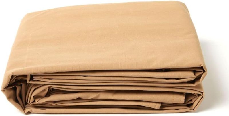 Photo 1 of Tarps Now 6x8 Feet Waterproof Canvas Tarp|20 MIL Commercial Grade, Heavy Duty, Tear-Resistant, Rustproof Brass Grommets, Reinforced Edges| Ideal for Construction, Trucking, Manufacturing –Tan Color