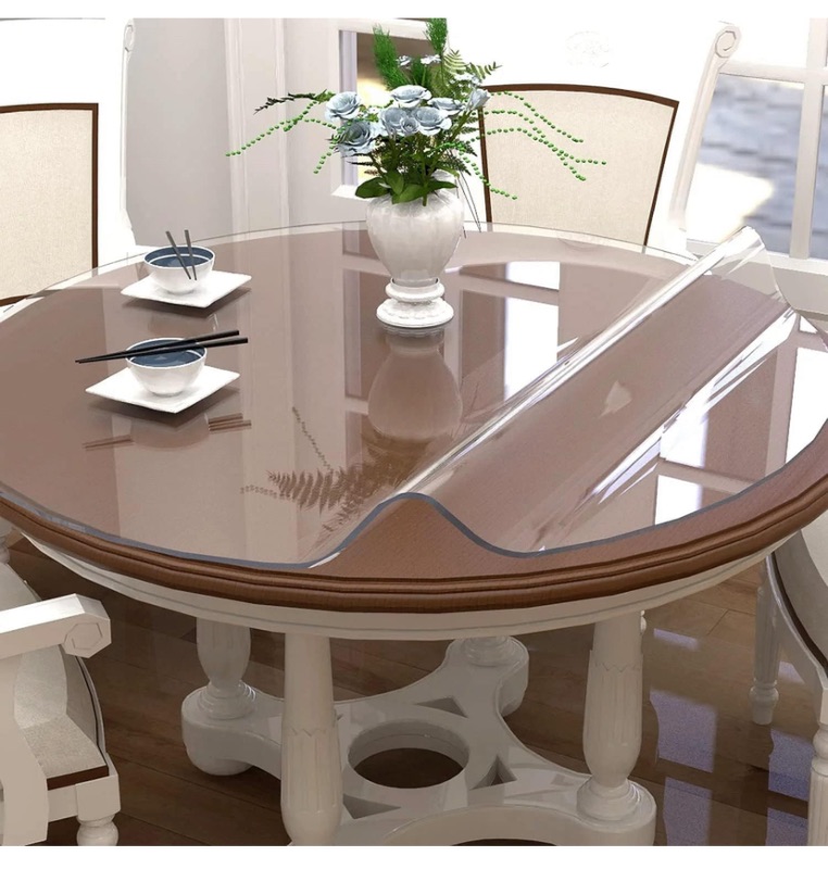 Photo 1 of OPEN PACKAGE**LIKE NEW**32 Inch Round Clear Table Cover Protector, 2mm Thick Upgraded Version, Unshrinkable Waterproof Scratch Resistant Plastic Tablecloth Protector Circle Table Pad for Coffee Table Dining Room Table