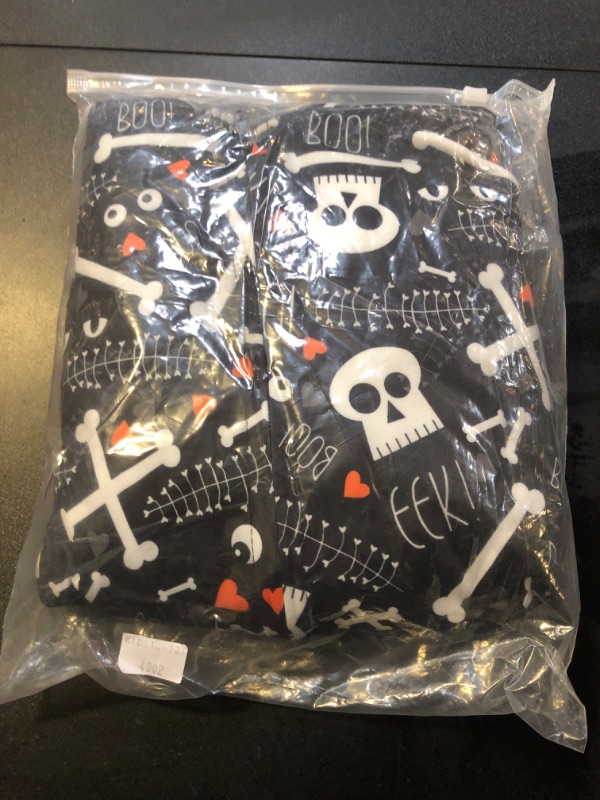 Photo 2 of VNVNE Matching Halloween Pajamas for Family?Pumpkin Skeleton Onesie Pjs for Adult/Couples/Women/Men?One Piece Holiday Loungewear Sleepwear(Youth,10-12T,Black/Skeleton)