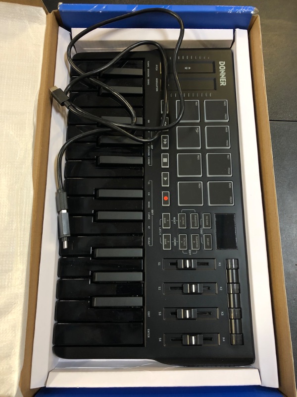 Photo 1 of Donner USB-C MIDI Keyboard Controller, 25 Key Portable Mini MIDI Keyboard with 8 Drum Pads, OLED Display, 16 Smart Scales, Arpeggio, Replay, 4 DAW Software and 40 Teaching Courses, DMK 25 Pro Black