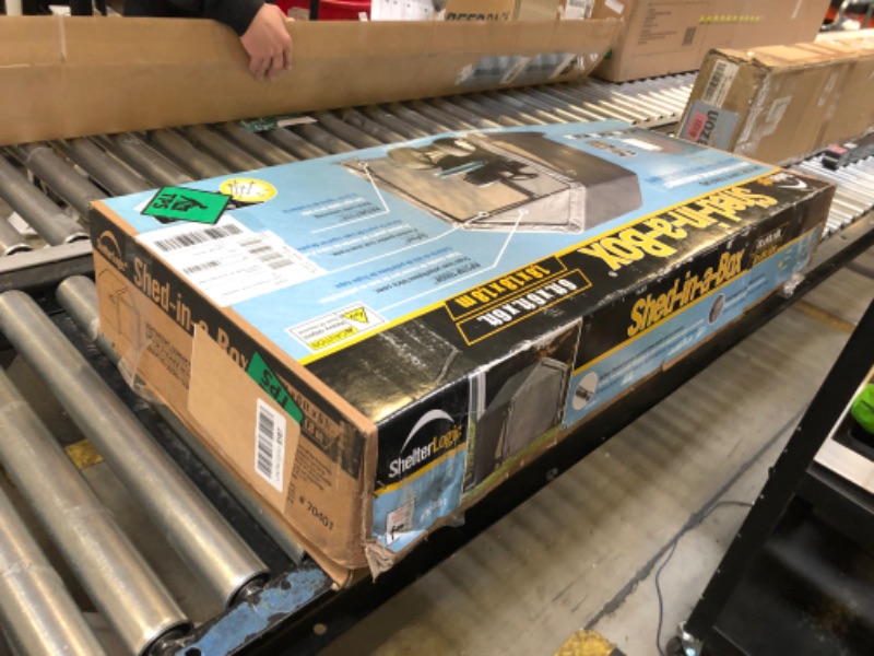 Photo 1 of ShelterLogic 6' x 6' Shed-in-a-Box All Season Steel Metal Peak Roof Outdoor Storage Shed with Waterproof Cover and Heavy Duty Reusable Auger Anchors, Grey