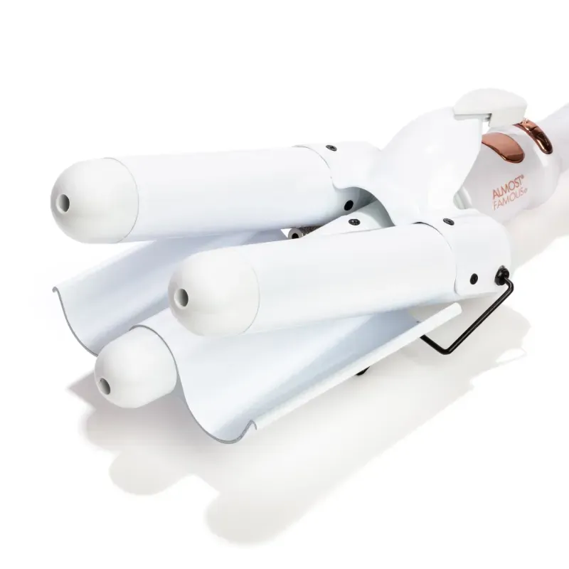 Photo 1 of Wave Away Triple Barrel Curler with Tourmaline Ceramic Barrels 1.25-inch barrels heat up to max temp in just a couple of minutes perfect voluminous beachy waves Japanese Tourmaline 2.4-meter long 360-degree swivel cord 135W Adjustable temperature settings