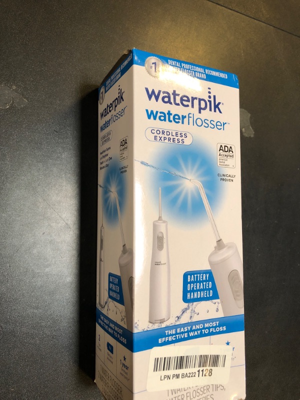 Photo 1 of Waterpik Cordless Water Flosser, Battery Operated & Portable for Travel & Home, ADA Accepted Cordless Express, White WF-02(Packaging may vary) White AA battery