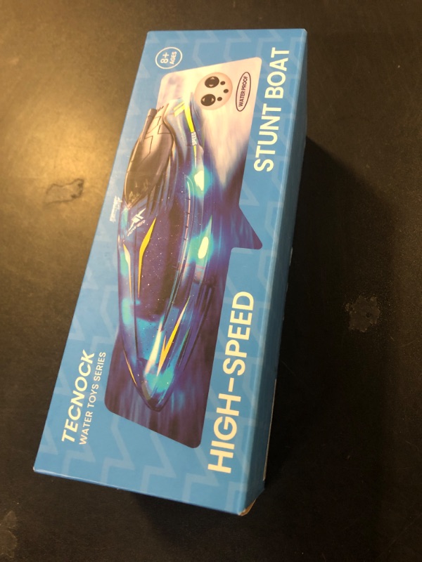 Photo 1 of Tecnock RC Boat for Kids - 2.4GHz Remote Control Boat with Waterproof for Pools and Lakes, 360° Flip Stunt Boat Toy with LED Lights, 2 Modular Rechargeable Battery, Gifts for Boys Girls