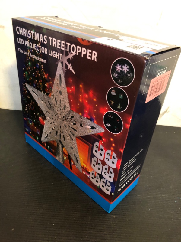 Photo 1 of Christmas Tree Topper Star Lighted with 6 Projection Modes, Comes with LED Christmas Ribbon Lights, Built-in Rotating LED Dynamic Projector, 3D Glitter Hollow Star Tree Topper Starry Night Light