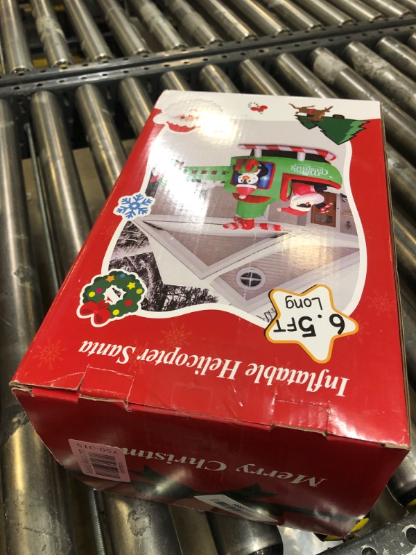 Photo 1 of FunFanso 6.5FT Christmas Inflatable Santa Claus on Helicopter Outdoor Decorations, Lighted Christmas Blow Up Santa Flying Airplane with Penguin & Gift Box for Xmas Lawn Yard Indoor Holiday Party Decor