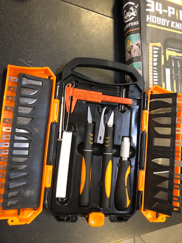 Photo 1 of MANUFORE 34pcs Large Exacto Knife set Deluxe Craft Precision Knife Set Include 3pcs Craft Knives with Anti-Slip Rubber Grip, 25pcs Different Blades, 2pcs Needles, Sharpening Stone, Screwdriver