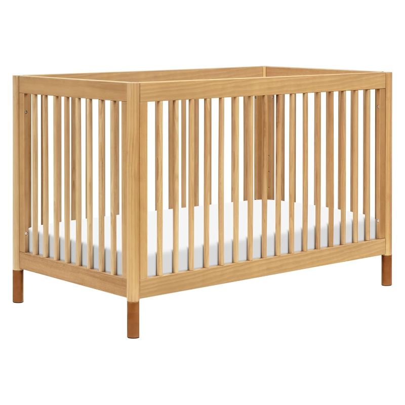 Photo 1 of ***USED - SCUFFED AND SCRAPED - MISSING FEET - OTHER PARTS LIKELY MISSING AS WELL - SEE PICTURES***
Babyletto Gelato 4-in-1 Convertible Crib with Toddler Bed Conversion in Honey with Vegan Tan Leather Feet, Greenguard Gold Certified
