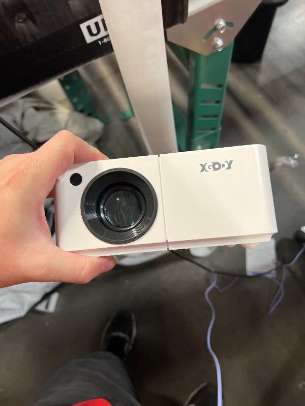 Photo 1 of Mini Smart Projector, XGODY X2 Android 12 Portable HD Projector 12000L 1080P Support with WiFi and Bluetooth, Electric Focus/Keystone, Built-in Netflix, YouTube 8000+ APP, Tripod Included(Pearl White)