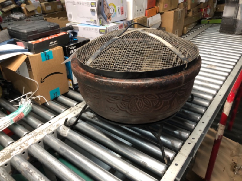 Photo 2 of ***NO PACKAGING - MAJOR DAMAGE - CRACKED - SEE PICTURES***
20 in. Clay Fire Pit with Iron Stand with extra metal grill pieces.