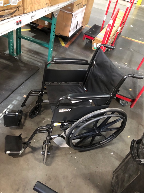 Photo 1 of ***NO PACKAGING - USED - SEE PICTURES***
Drive Medical SSP118FA-SF Silver Sport 1 Folding Transport Wheelchair with Full Arms and Removable Swing-Away Footrest, Black