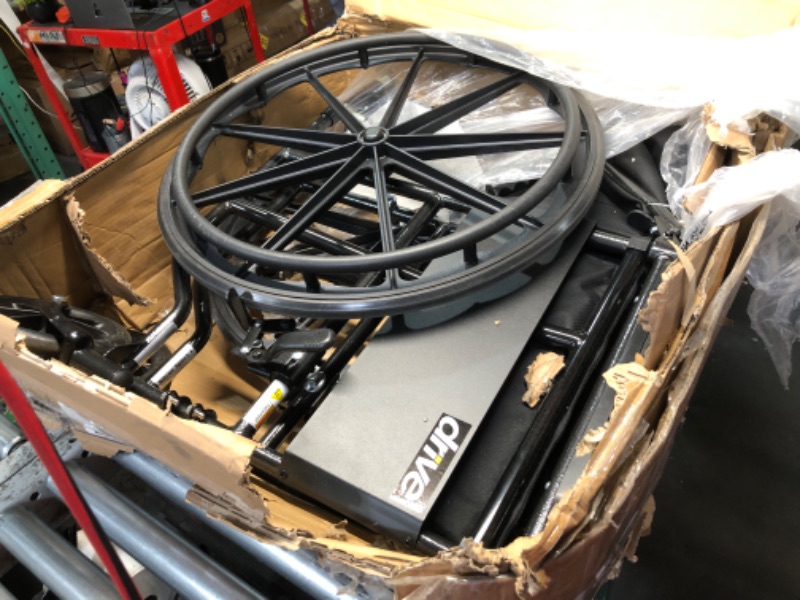 Photo 1 of ***NO PACKAGING - USED - SEE PICTURES***
Drive Medical SSP118FA-SF Silver Sport 1 Folding Transport Wheelchair with Full Arms and Removable Swing-Away Footrest, Black
