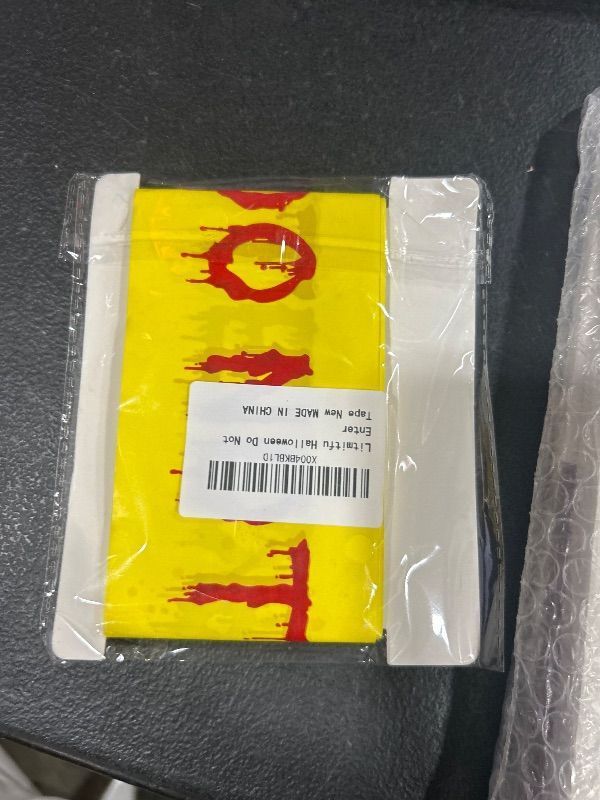 Photo 1 of Halloween Decorations Caution Tape - Yellow and Red Do Not Enter Scary Caution Tape, 3 Inch x 82 Ft Spooky Halloween Blood Handprint Warning Tape for Halloween Indoor Outdoor Decorations Party Decor