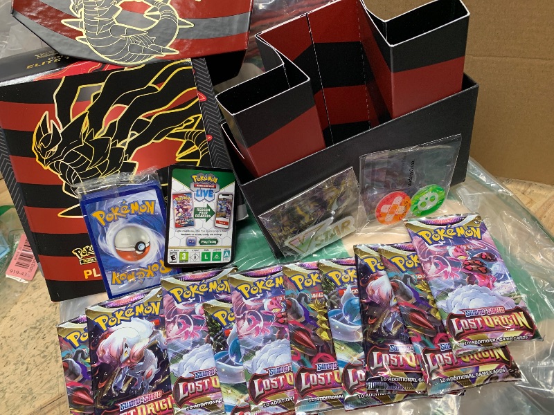 Photo 2 of **card packs have been opened , unknown if missing**
Pokemon TCG: Sword & Shield-Lost Origin Pokemon Center Elite Trainer Box