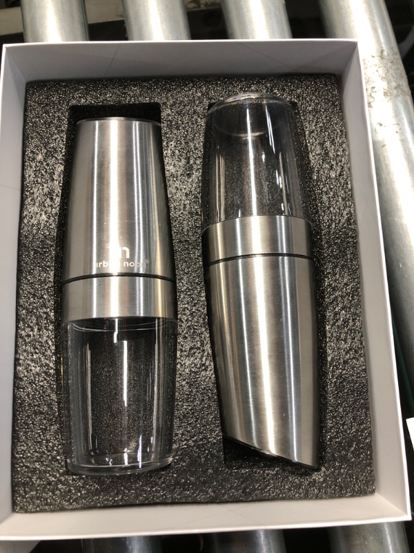 Photo 1 of **ONE GRINDER IS MISSING PLASTIC COVER PIECE ON END** Urban Noon Gravity Salt and Pepper Grinder Set - Battery Operated Stainless Steel Mills with Light (2 Grinders) - Automatic One Handed Operation - Electric Adjustable Shakers - Ceramic Grinders