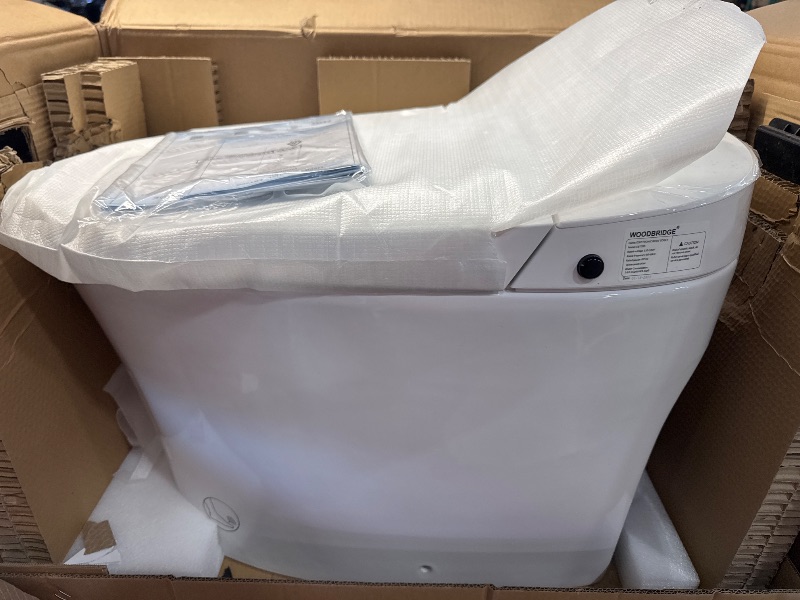 Photo 3 of *DAMAGE/CRACKED IN THE BACK** WOODBRIDGE Smart Bidet Toilet, Auto Open & Close, Auto Flush, Foot Sensor Operation, Heated Seat and Integrated Multi Function Remote Control in White,EBT 700