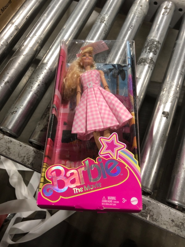 Photo 2 of Barbie The Movie Doll, Margot Robbie as, Collectible Doll Wearing Pink & White Gingham Dress with Daisy Chain Necklace