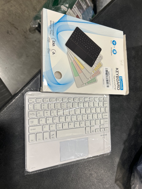 Photo 1 of Wireless Backlit Bluetooth Keyboard with Touchpad,10 inch Ultra Slim 7Colors Backlit Portable Rechargeable Keyboard with Trackpad for IPad/IPad Pro iOS Android Tablets Windows Laptop PC(White)