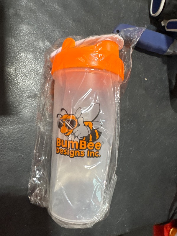 Photo 2 of BUMBEE DESIGNS INC. Sports Nutrition Shaker Blender Bottle Perfect for Protein Shakes and Pre Workout, 20-Ounce, Clear/Orange