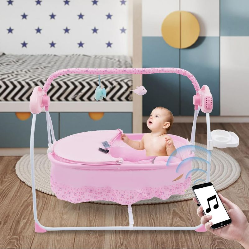 Photo 1 of Baby Bassinet Swing, Bluetooth Connection Enabled Baby Rocker with Remote Control Timing Function , Portable Electric Baby Swing Chair with 12 Songs and 5 Swing speeds for Newborns 0-18 Months.