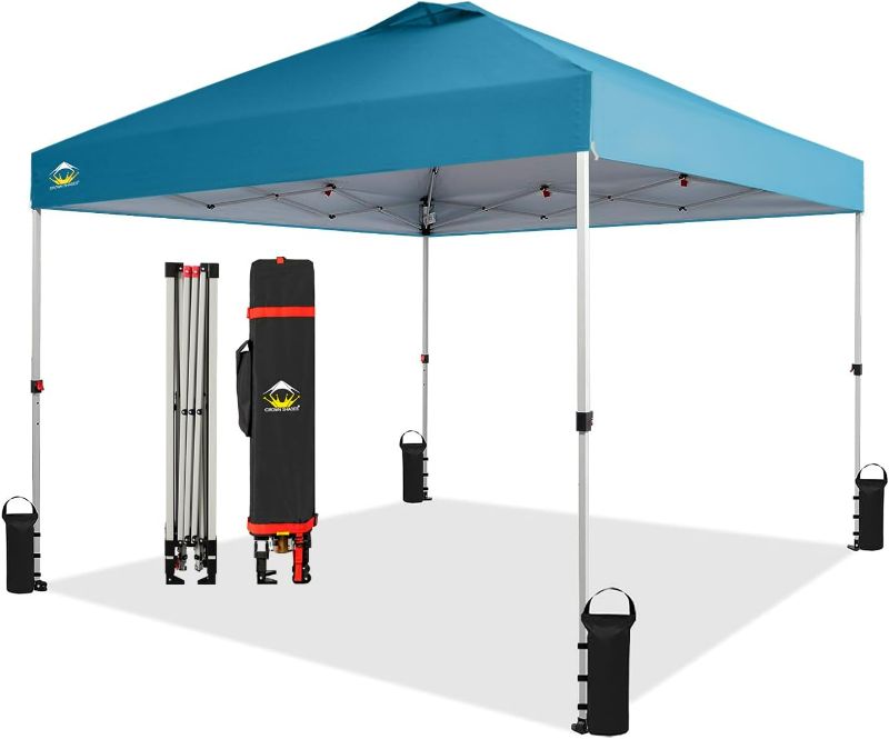 Photo 1 of CROWN SHADES 10x10 Pop Up Canopy - Beach Tent with One Push Setup - Easy Outdoor Sun Shade for Events, Parties, Camping - Gazebo with STO-N-Go Cover Bag, Silver Coated Top, Cyan Blue