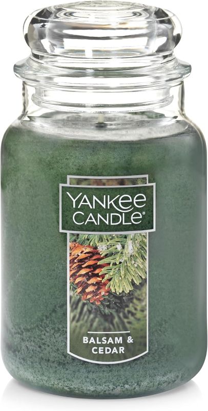 Photo 1 of Yankee Candle Balsam & Cedar Scented, Classic 22oz Large Jar Single Wick Candle, Over 110 Hours of Burn Time, Ideal Holiday Gift
