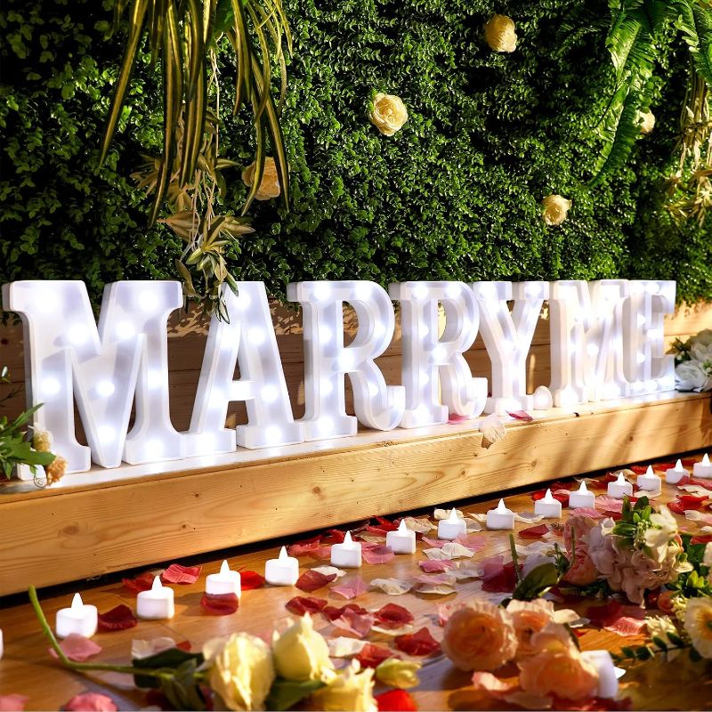 Photo 1 of Hortsun Marry Me Light up Letters Proposal Decorations Will You Marry Me Sign Rose Petals 24 LED Candles Romantic Night Light for Proposal Engagement Wedding Outdoor(Colorful)

