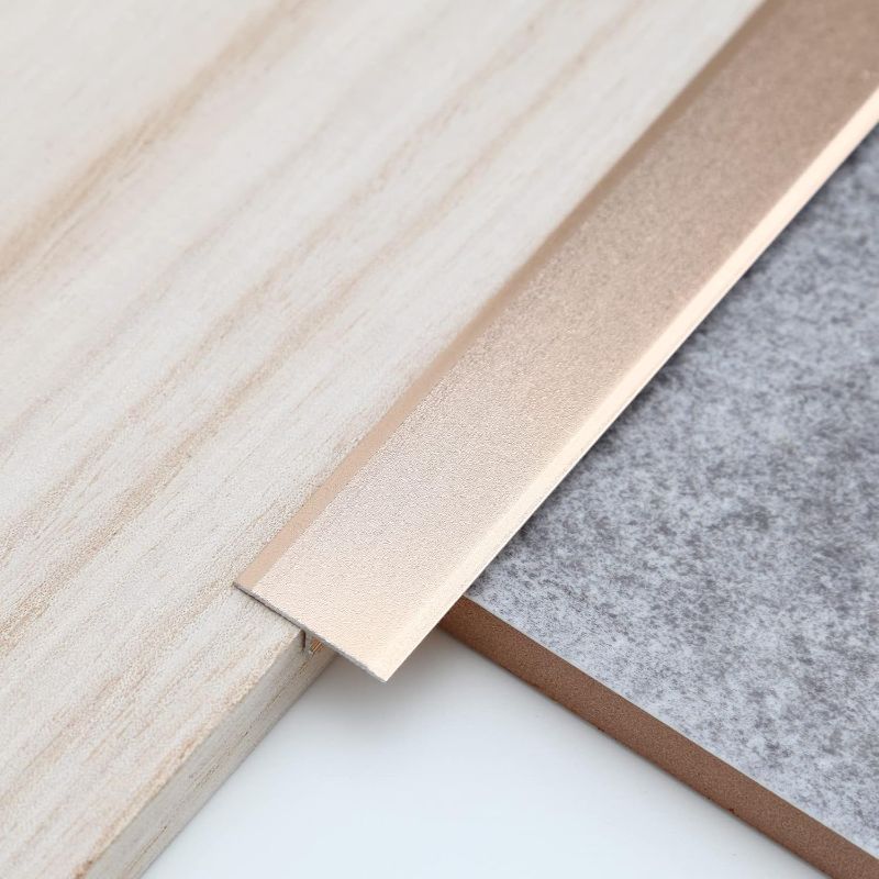 Photo 1 of 3Pcs Aluminum T Molding Trim & Floor Transition Strips, Flat Divider Strip for Door Threshold and Joining Flooring Gaps of Laminate Planks Tile (2.9Ft x 0.8In, Matte Gold) 
