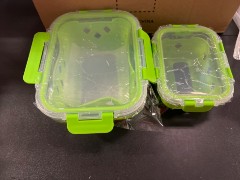 Photo 1 of 2 glass containers 