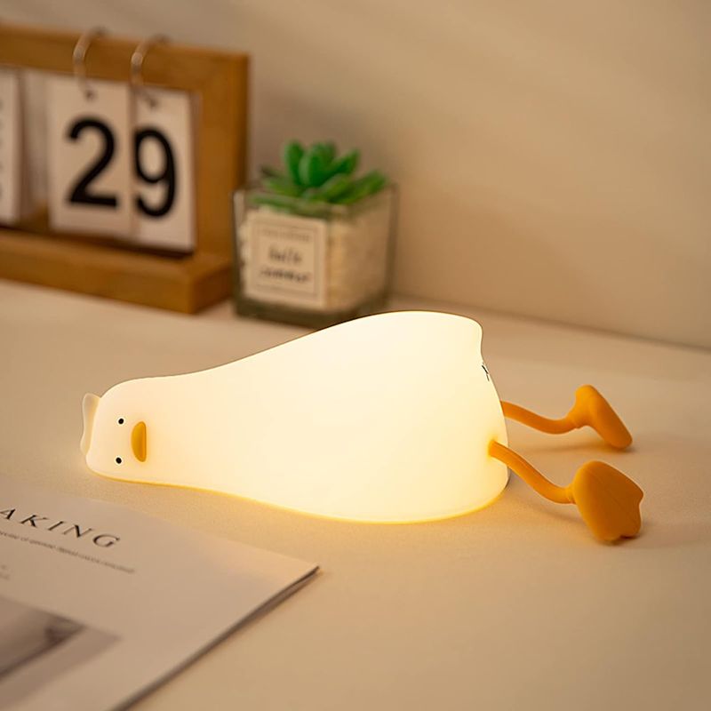 Photo 1 of Benson Lying Flat Duck Night Light, LED Squishy Duck Lamp, Cute Light Up Duck, Silicone Dimmable Nursery Nightlight, Rechargeable Bedside Touch Lamp for Breastfeeding, Finn The Duck