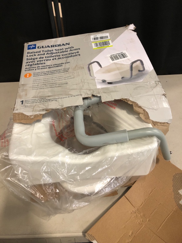 Photo 2 of Medline 5" Elongated Raised Toilet Seat, with Lock and Removable Padded Arms- A Medical Seat for Seniors, Elderly, Adults, or Post-Surgery Recovery, 1 Ct.