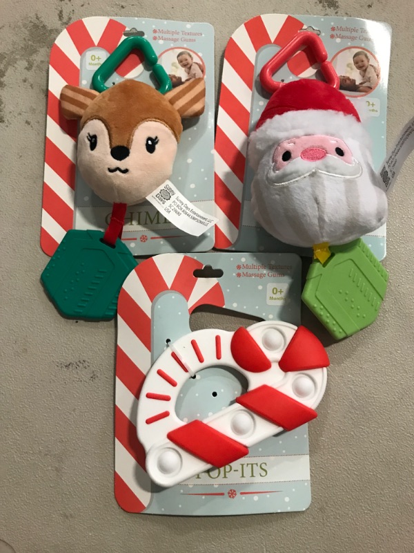 Photo 1 of Sunny Days Chimes & Teethers - Reindeer , Santa, & Candy Cane

