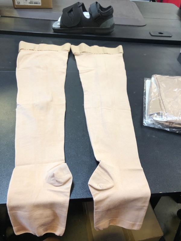 Photo 1 of 2 pair of tan compression socks