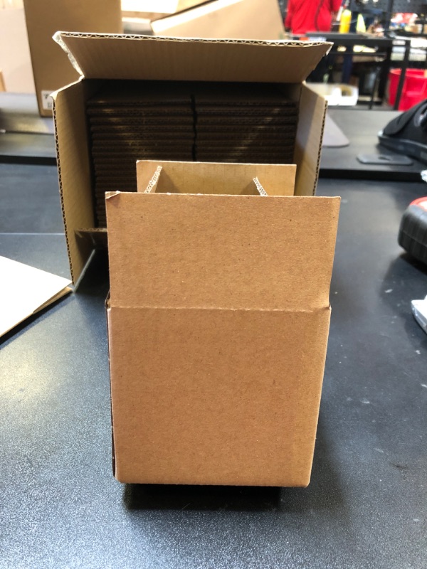 Photo 1 of 4 x 4 inch cardboard boxes 26 count