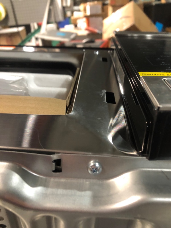Photo 5 of ***DAMAGED - DENTED - DOOR DOESN'T CLOSE - SEE PICTURES***
GE GCST10A1WSS 4-in-1 Microwave Oven, 1,050 Watts Air Fryer, Broiler & Convection Mode, Kitchen Essentials for The Countertop or Dorm Room, Child-Lock Technology 1.0 Cu. Ft, Stainless Steel