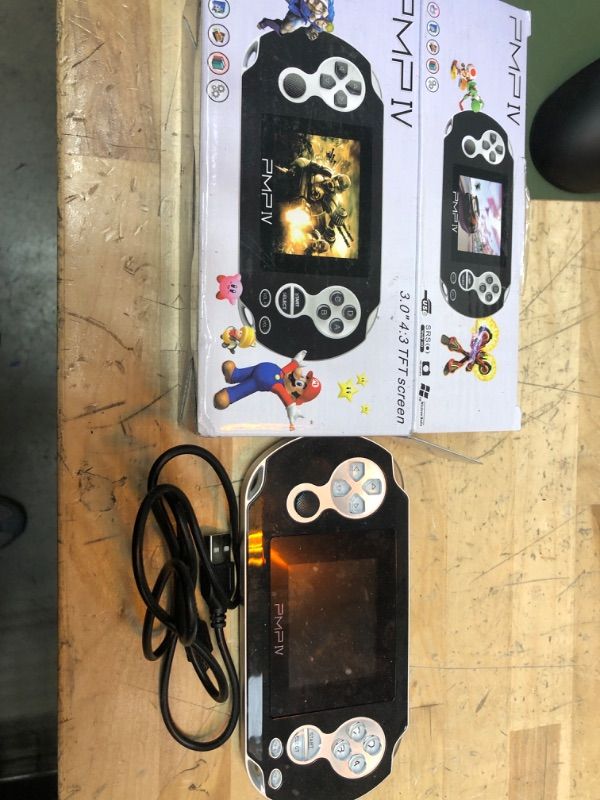 Photo 1 of Daxceirry PMP4 Retro Portable Handheld Emulator Game Console 32 Bit 500 in 1 Game PMPIV Classic Console Support Headphone Output Video HD Display