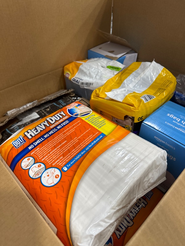 Photo 1 of 3 training dog pads, 3 amazon trash bags, medium dog disposable diapers, cat litter pan, dishwasher detergent, dog diapers. 