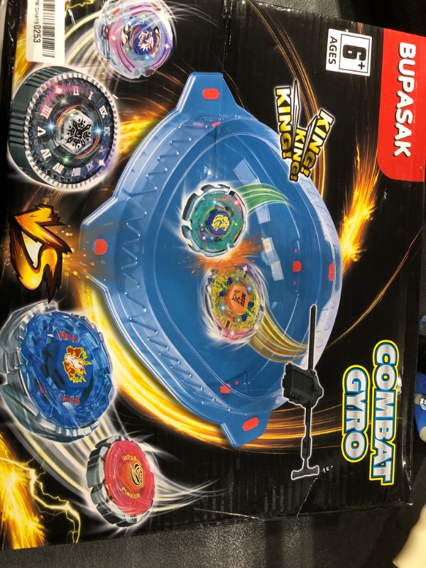 Photo 2 of BUPASAK Light Ignite Spinning Tops Battle Set, with Bey Stadium, 6 Light Ignite Spinning Tops, and 2 Launchers, Toys for 6 Year Old Boys & Girls & Up (Amazon Exclusive)