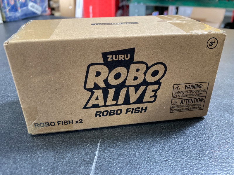 Photo 2 of Robo Alive Robo Fish Robotic Swimming Fish (Teal + Orange) by ZURU Water Activated, Changes Color, Comes with Batteries, Amazon Exclusive (2 Pack) Series 3