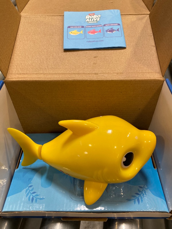 Photo 1 of Robo Alive Junior Baby Shark New Silicon Fins Version Singing and Swimming Baby Shark (Yellow) by ZURU