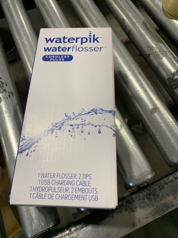 Photo 1 of Waterpik Cordless Pulse Rechargeable Portable Water Flosser for Teeth, Gums, Braces Care and Travel with 2 Flossing Tips, Waterproof, ADA Accepted, WF-20 Blue, Packaging May Vary