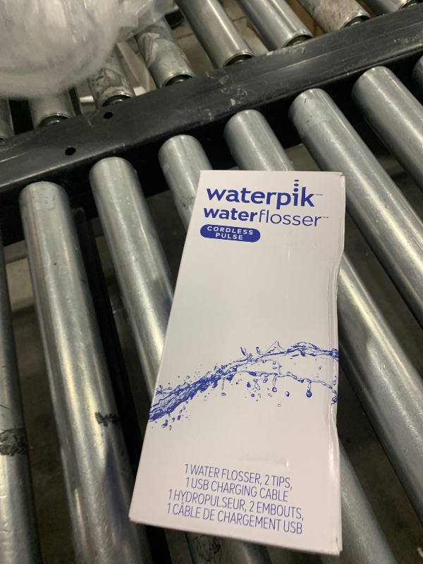 Photo 2 of Waterpik Cordless Pulse Rechargeable Portable Water Flosser for Teeth, Gums, Braces Care and Travel with 2 Flossing Tips, Waterproof, ADA Accepted, WF-20 Blue, Packaging May Vary