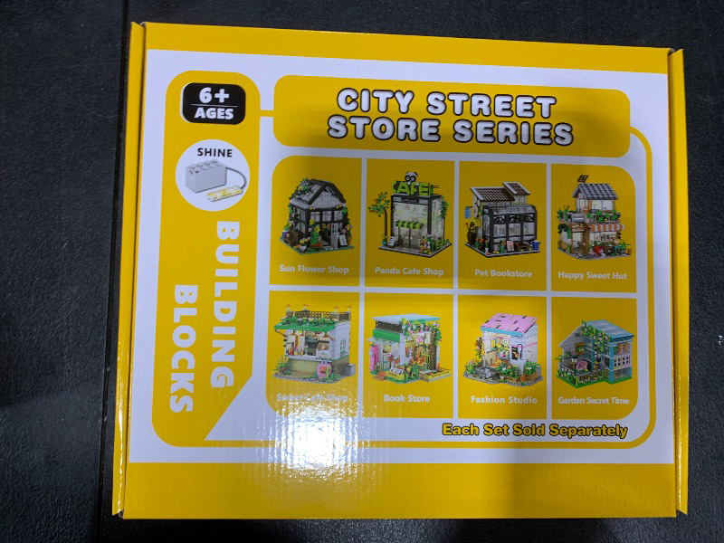 Photo 2 of City House Building Toy Set, 584 PCS Pet Book Shop City Street Building Blocks Set with Bicycle & 2 Cat, House Building Toy with LED Light for Girl Boy 6-12, Openable House Building Set Roleplay Gift