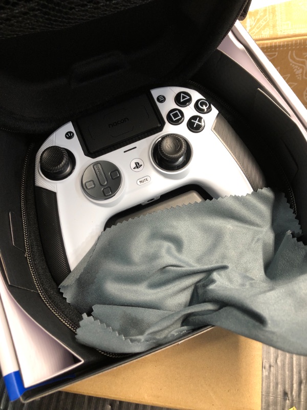 Photo 1 of NACON Revolution 5 Pro Officially Licensed PlayStation Wireless Gaming Controller for PS5 / PS4 / PC - Hall Effect, Trigger Stops, Mappable Buttons, Bluetooth Audio - Black/White